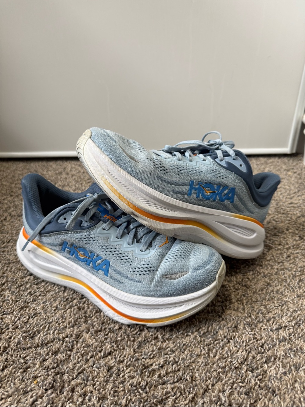 Hoka Bondi 9 Light Blue Running Sneakers with Orange Accents